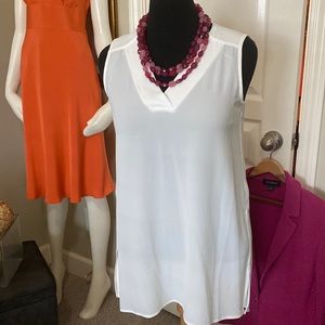 What an amazing white top, v neck, sleeveless.